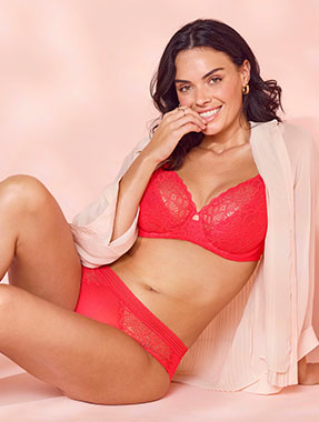 Model wearing a pink bra with all-over lace cups and matching briefs