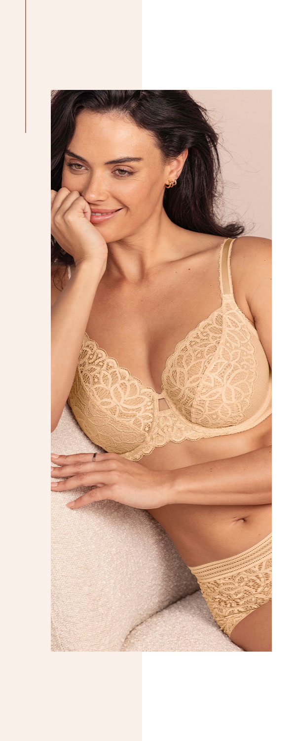 Model wearing a neutral bra with all-over lace cups and matching briefs